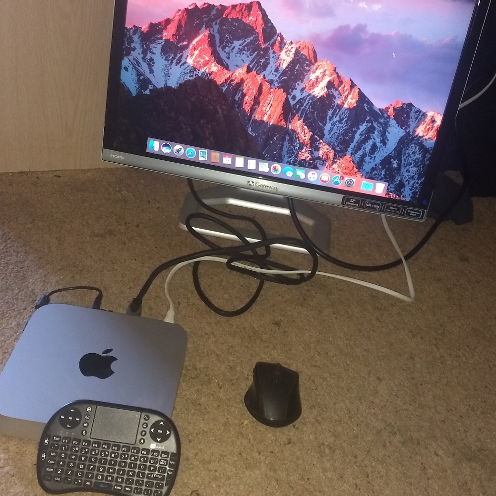Computer desktop Apple Mac Mini with wireless keyboard and mouse